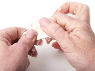 Penny Brite being rubbed onto metal square